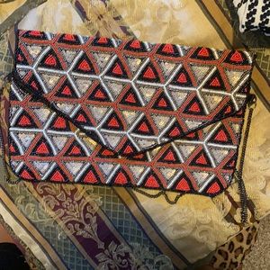 Orange , gold and black bohemian style clutch